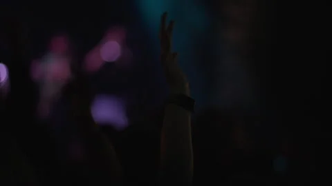 Dark concert crowd silhouettes barely visible in deep blue glow Video stock 336853458