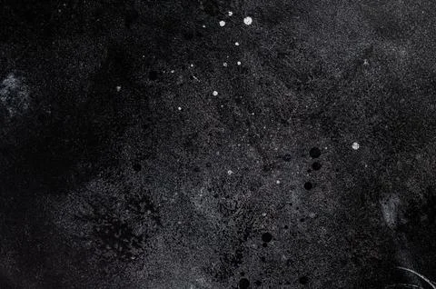 Dark concrete background with textured surface and paint splashes perfect f.. Stock Photos