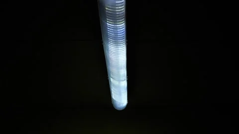 A dark corridor with flashing and broken lamps on the ceiling. Stock Footage 311152461