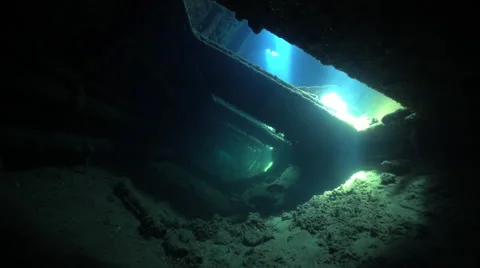 Dark corridor of shipwreck with vibrating sunlight - Umbria, Sudan Stock Footage 67445423