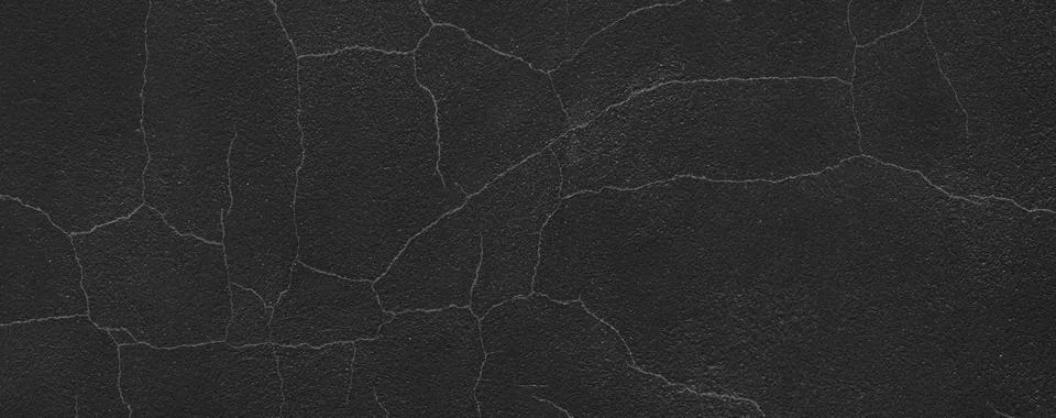 Dark cracked wall texture creating abstract grungy background 写真素材