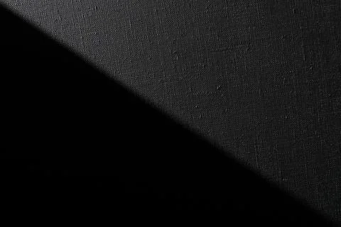 Dark creative background: black primed linen canvas, uneven lighting, toning Stock Illustration