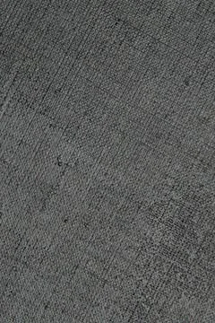 Dark creative background: black primed linen canvas, uneven lighting, toning Stock Photos