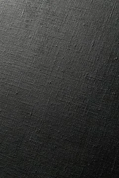 Dark creative background: black primed linen canvas, uneven lighting, toning Stock Photos