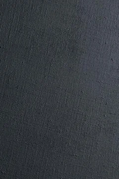 Dark creative background: black primed linen canvas, uneven lighting, color t Stock Photos