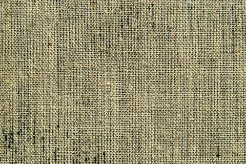 Dark creative background: reverse side of black-primed linen canvas, uneven l Stock Photos