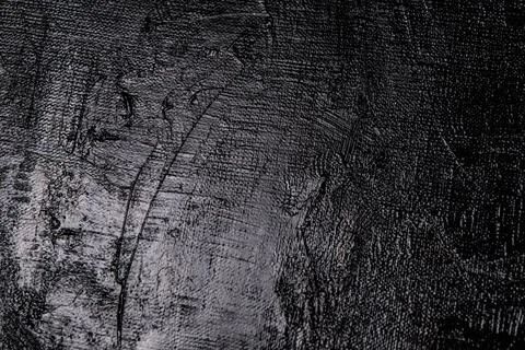 Dark creative background - rough linen canvas unevenly covered with black pri Stock Photos