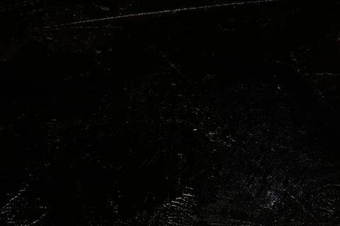 Dark creative background - rough linen canvas unevenly covered with black pri Stock Photos