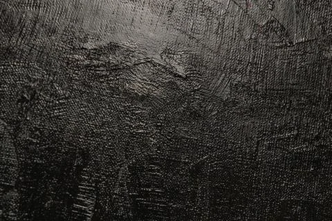 Dark creative background - rough linen canvas unevenly covered with black pri Stock Photos