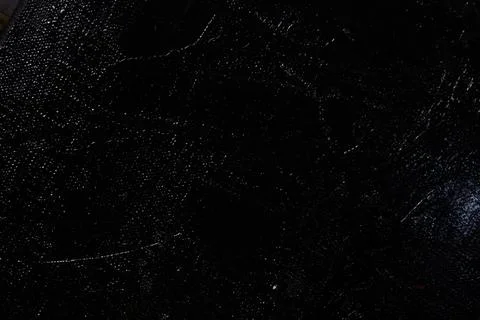 Dark creative background - rough linen canvas unevenly covered with black pri Stock Photos