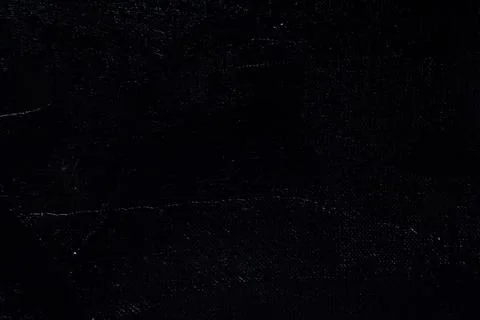 Dark creative background - rough linen canvas unevenly covered with black pri Stock Photos