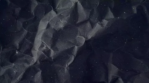 Dark Crumpled Paper Texture Background with Floating Dust Particles Stock Footage 336925626