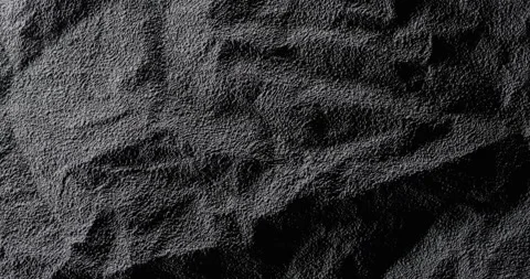 Dark crumpled texture surface rotating. Vídeo Stock 336914464
