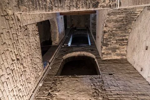 Dark crypt with big arches Stock Photos