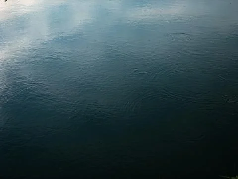 Dark deep blue Waves ripple claming Lake background Stock Photos