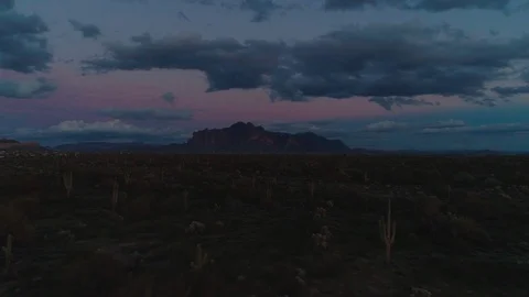 Dark Desert Mountains with Foreboding Clouds at Night 動画素材 103537026