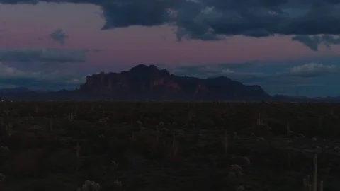 Dark Desert Mountains with Foreboding Clouds at Night Stock Footage 103537042