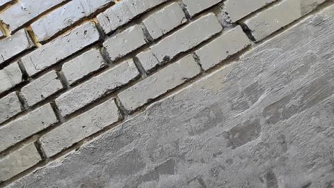 Dark dirty bricks. Old dark brick wall. Vintage background Stock Photos