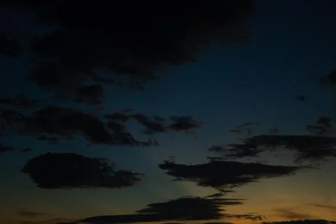 Dark Dramatic Clouds at Sunset Stock Photos