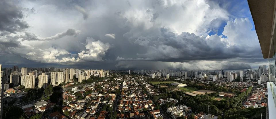 Dark dramatic cloudy sky on a stormy day. Panoramic photo. Stock Photos