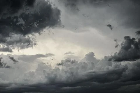 Dark dramatic sky with black storm clouds. Stock Photos
