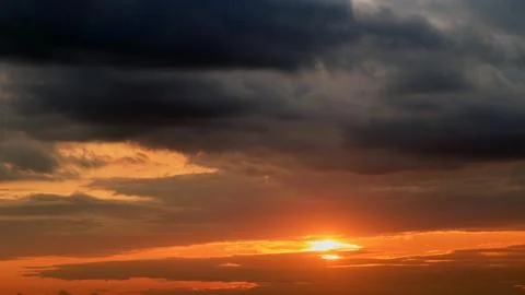 Dark dramatic sky with cloud at sunset background. Sky clouds. Stock Photos