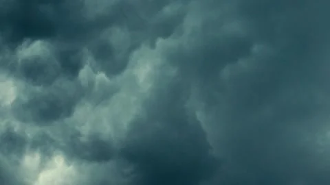 Dark dramatic storm clouds gathering in the sky before a thunderstorm. Stock Footage 340138222