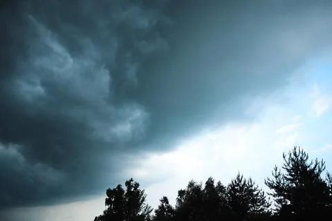 Dark dramatic storm clouds before heavy rain texture background Stock Photos