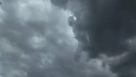 Dark, dramatic thunderstorm clouds moving rapidly across the sky in timelapse 動画素材 331529098