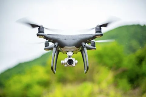 Dark drone in flight. Stock Photos