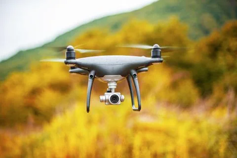 Dark drone in flight. Stock Photos