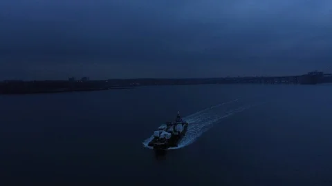 Dark dusk scary half orbit of tugboat and barge bridge reveal 스톡 동영상 114087656