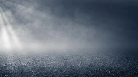 Dark empty asphalt ground at night with atmospheric fog, smoke, and a brigh.. Stock Photos