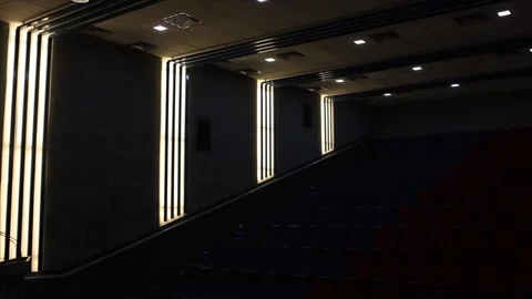 Dark Empty Auditorium Interior with Illuminated Wall Panels Stock Footage 332143797