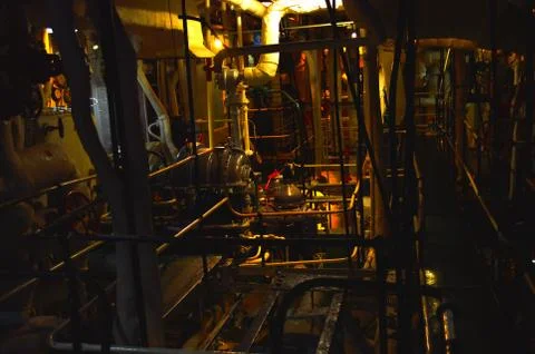 Dark engine room in a ship Stock Photos