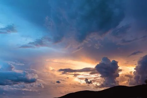 Dark epic sunrise in the sky with clouds. Copy space. Cloudy background 스톡 사진