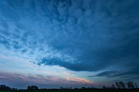 Dark evening cloud over the horizon Stock Photos