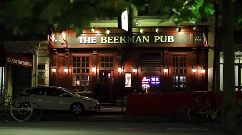 Dark evening pub with a guy on the phone Stock-Footage 51034784