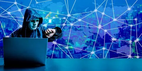 Dark face using laptop computer for cyber attack and checking time Stock Photos