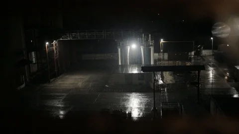 Dark factory in night light raining technology construction city industrial Stock Footage 96123702