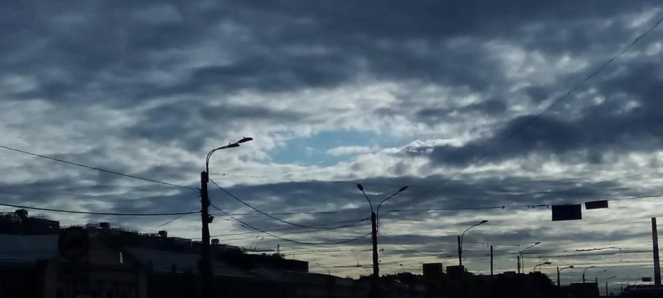 Dark feather clouds at dawn Stock Photos
