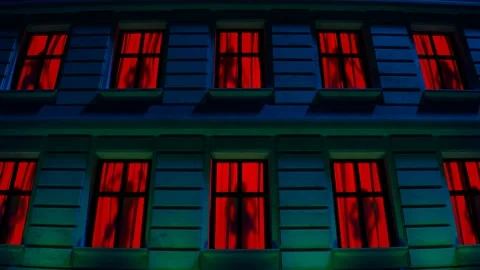 Dark female dancer silhouettes at the red windows. Men's nightclub, strip club. Stock-Footage 201212883
