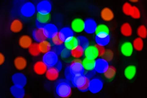 The dark festive blurred background has bokeh Stock Photos