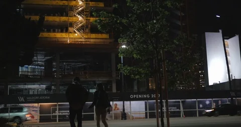 Dark Figures Approach Construction Site Stock Footage 87722219