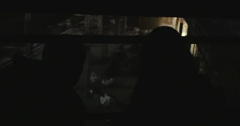 Dark Figures Explore Construction Site Stock Footage 87722265