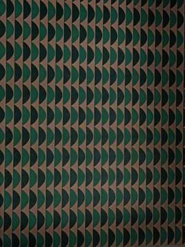 Dark geometric wall pattern in muted green beige and black tones Stock Photos