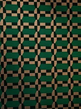 Dark geometric wall pattern in muted green beige and black tones Stock Photos