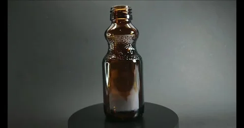 Dark glass bottle 4k Stock Footage 328131209