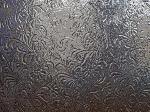 Dark glass texture with patterns, glass texture behind which there is light Stock Photos