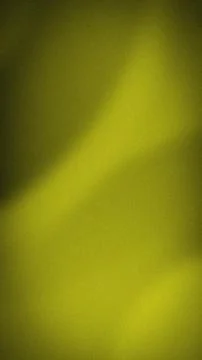 Dark gold grainy gradient background with mustard yellow light and olive sh.. Stock Photos
